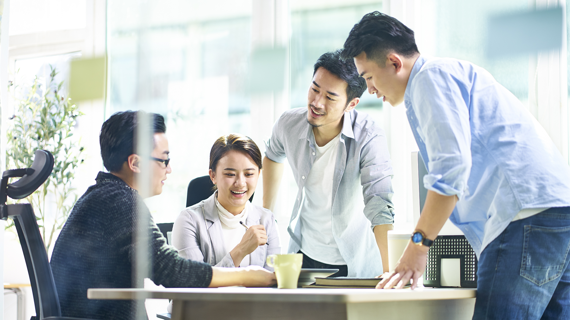 Group of employees reviewing talent acquisition analytics