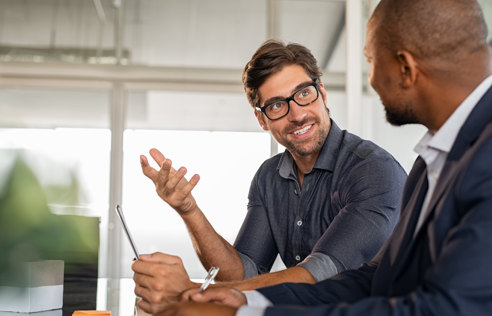 Male consultant engaging in 1:1 discussion with client.