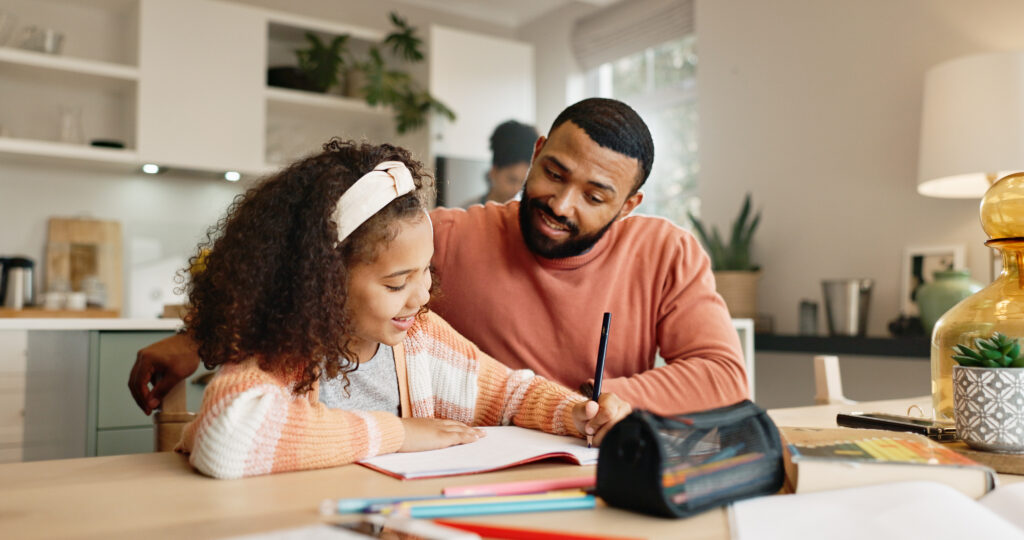 parent helping daughter with homework